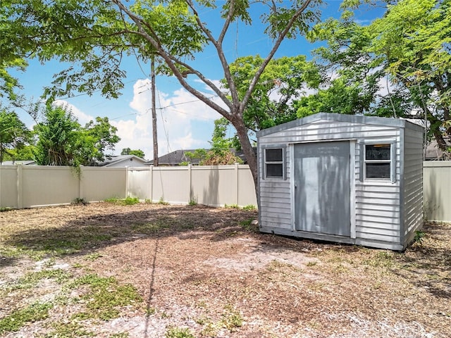 view of shed with a fenced backyard