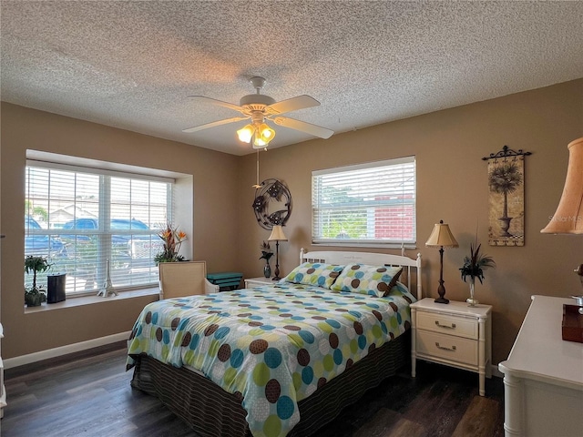 3804 Perugia Ave, Sebring, FL 33872 - bedroom with dark wood-style floors, a textured ceiling, ceiling fan, and baseboards