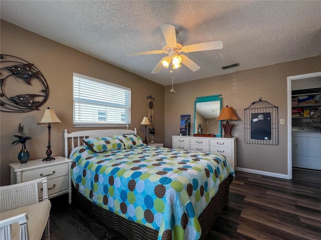3804 Perugia Ave, Sebring, FL 33872 - bedroom featuring washer / dryer, dark wood finished floors, a textured ceiling, a ceiling fan, and baseboards