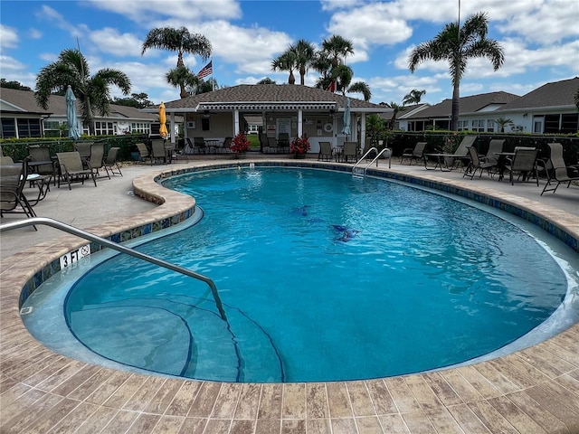 3804 Perugia Ave, Sebring, FL 33872 - community pool featuring a patio and fence