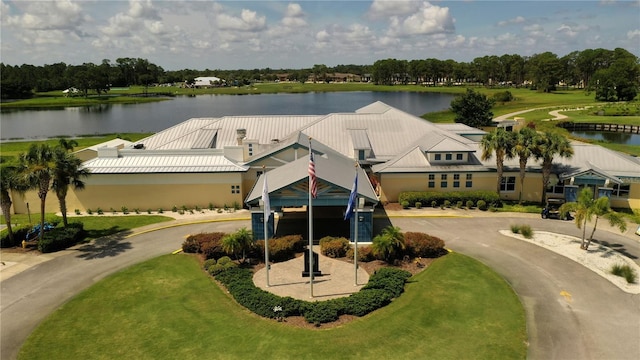 3804 Perugia Ave, Sebring, FL 33872 - view of front facade with a water view, curved driveway, and view of wooded area