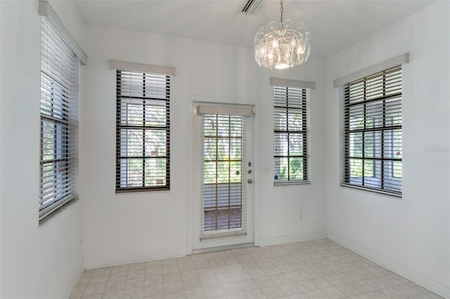 1131 Country Oaks Blvd, Lake Wales, FL 33898 - entryway featuring a chandelier and baseboards