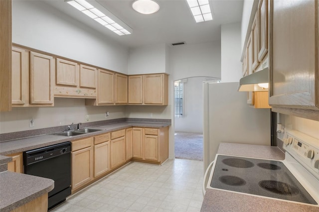 1131 Country Oaks Blvd, Lake Wales, FL 33898 - kitchen with white electric stove, black dishwasher, a sink, and light brown cabinetry
