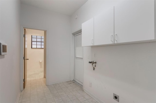 1131 Country Oaks Blvd, Lake Wales, FL 33898 - laundry area with electric dryer hookup, cabinet space, and baseboards