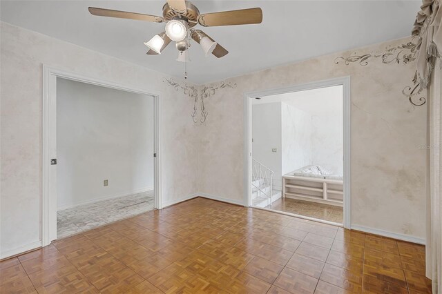 900 Howard Ter NW, Winter Haven, FL 33881 - empty room with ceiling fan, baseboards, and stairway