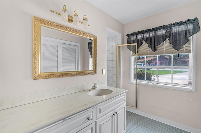 900 Howard Ter NW, Winter Haven, FL 33881 - bathroom with vanity and tile patterned flooring