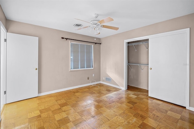 900 Howard Ter NW, Winter Haven, FL 33881 - unfurnished bedroom featuring baseboards, a closet, and a ceiling fan