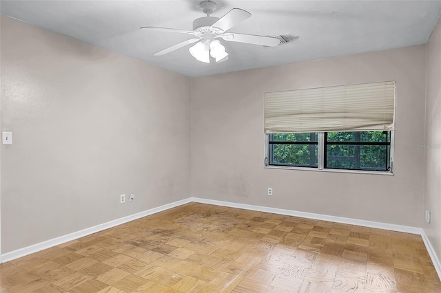 900 Howard Ter NW, Winter Haven, FL 33881 - unfurnished room with baseboards and a ceiling fan