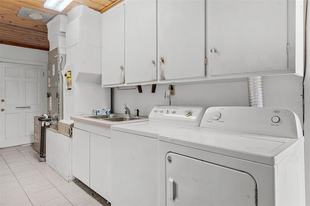 900 Howard Ter NW, Winter Haven, FL 33881 - laundry area featuring cabinet space, wood ceiling, separate washer and dryer, and light tile patterned floors