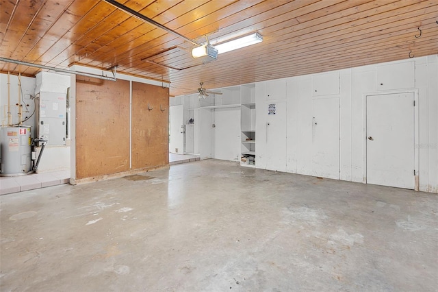 900 Howard Ter NW, Winter Haven, FL 33881 - garage featuring water heater, a garage door opener, and a ceiling fan