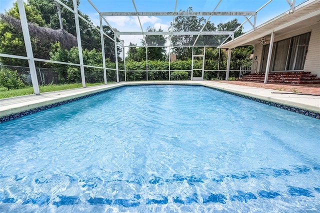 900 Howard Ter NW, Winter Haven, FL 33881 - swimming pool with ceiling fan and a lanai