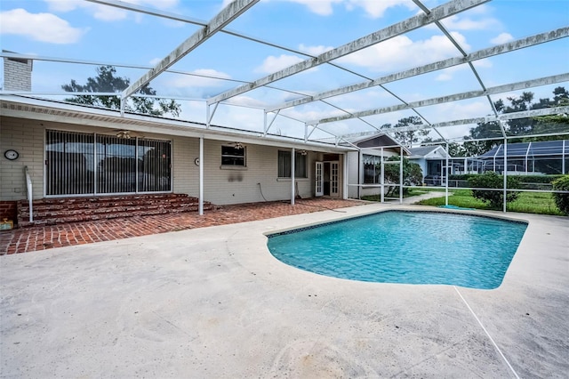 900 Howard Ter NW, Winter Haven, FL 33881 - outdoor pool with a patio area, glass enclosure, and ceiling fan