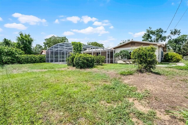 900 Howard Ter NW, Winter Haven, FL 33881 - view of green lawn featuring a lanai