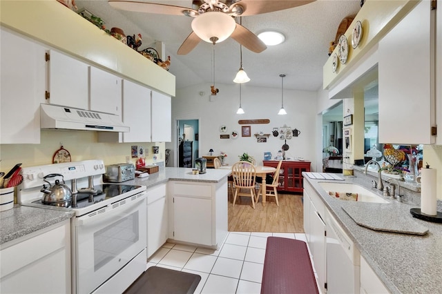 3154 Prairie Dunes Cir W, Lakeland, FL 33810 - kitchen with white appliances, premium range hood, light countertops, a peninsula, and a ceiling fan