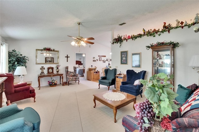 3154 Prairie Dunes Cir W, Lakeland, FL 33810 - carpeted living area with a textured ceiling, ceiling fan, and lofted ceiling