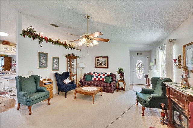 3154 Prairie Dunes Cir W, Lakeland, FL 33810 - carpeted living area featuring a ceiling fan and a textured ceiling