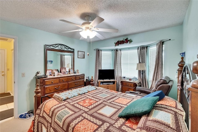 3154 Prairie Dunes Cir W, Lakeland, FL 33810 - bedroom with a textured ceiling and a ceiling fan