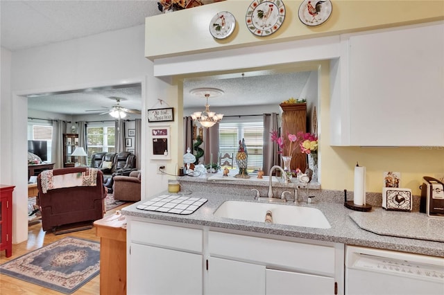 3154 Prairie Dunes Cir W, Lakeland, FL 33810 - kitchen featuring dishwasher, white cabinetry, light wood-type flooring, a textured ceiling, and ceiling fan