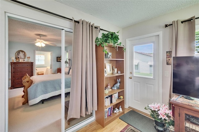 3154 Prairie Dunes Cir W, Lakeland, FL 33810 - bedroom featuring a textured ceiling and wood finished floors