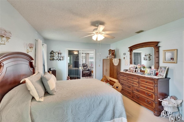 3154 Prairie Dunes Cir W, Lakeland, FL 33810 - bedroom with a textured ceiling, ceiling fan, and carpet floors