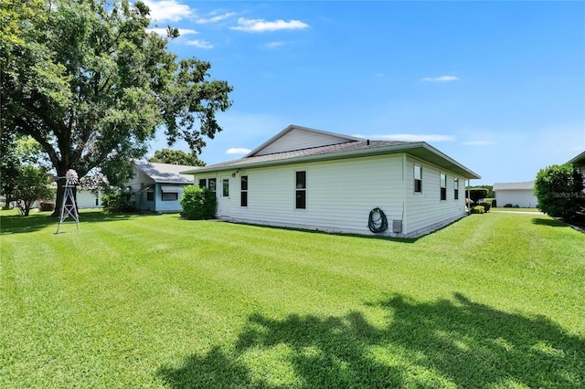 3154 Prairie Dunes Cir W, Lakeland, FL 33810 - rear view of property with a lawn