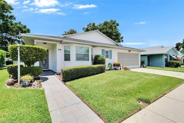3154 Prairie Dunes Cir W, Lakeland, FL 33810 - single story home with a front lawn, a garage, concrete driveway, and roof with shingles