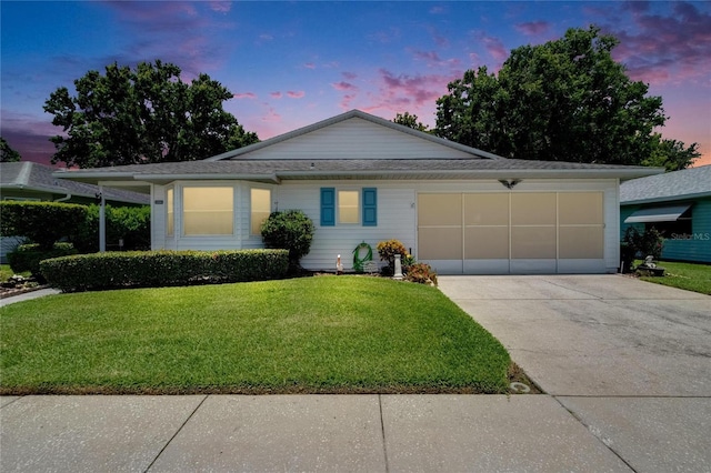 3154 Prairie Dunes Cir W, Lakeland, FL 33810 - ranch-style home featuring concrete driveway, an attached garage, and a front yard