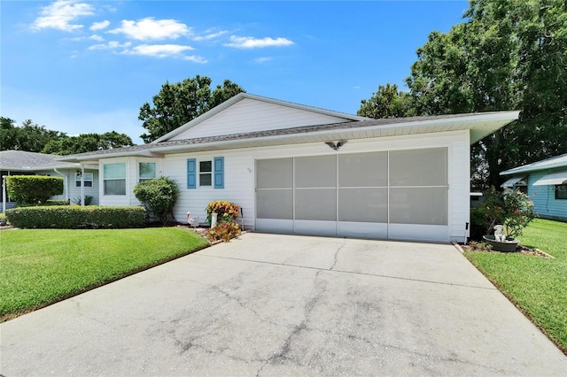 3154 Prairie Dunes Cir W, Lakeland, FL 33810 - view of front of home featuring concrete driveway, a front yard, and a garage