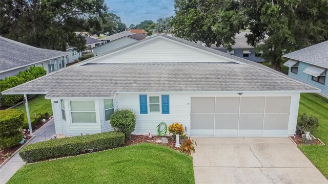 3154 Prairie Dunes Cir W, Lakeland, FL 33810 - ranch-style home featuring roof with shingles, concrete driveway, and a front yard