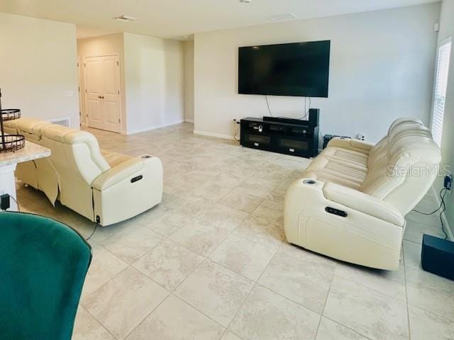 264 Fiddlewood Ct, Davenport, FL 33837 - living area featuring light tile patterned floors