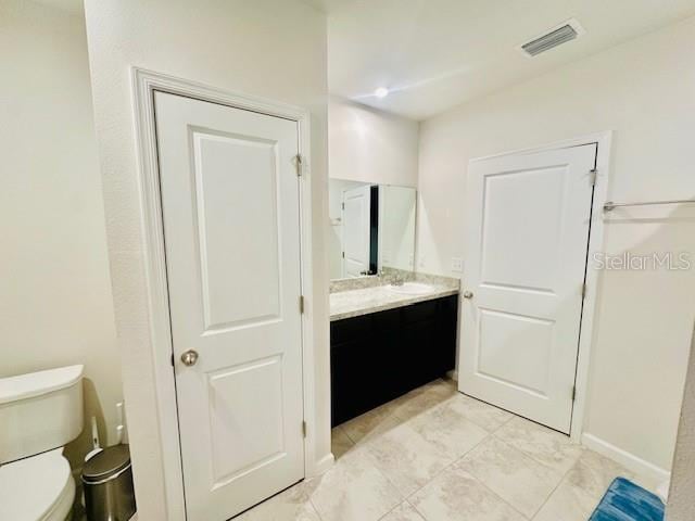 264 Fiddlewood Ct, Davenport, FL 33837 - bathroom featuring vanity and tile patterned floors