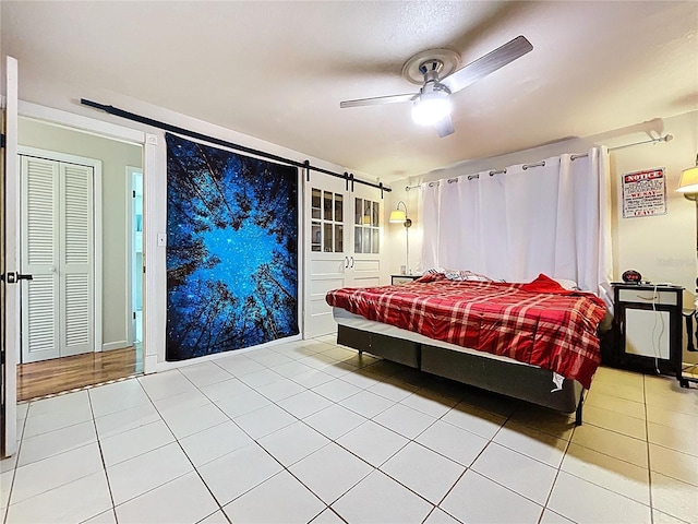 4966 Foxrun Ln, Lakeland, FL 33813 - bedroom featuring tile patterned floors and a ceiling fan