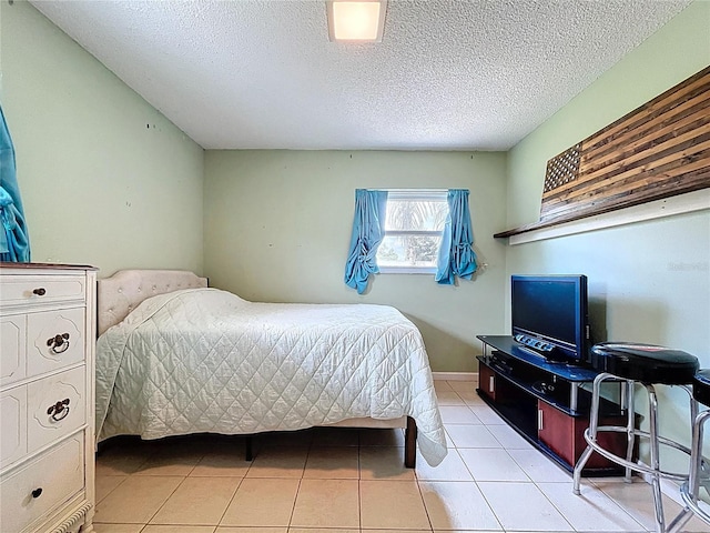 4966 Foxrun Ln, Lakeland, FL 33813 - bedroom featuring light tile patterned floors and a textured ceiling