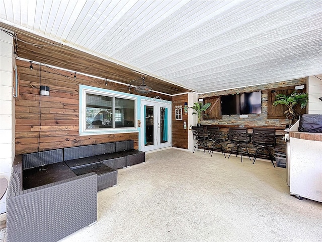 4966 Foxrun Ln, Lakeland, FL 33813 - view of patio with french doors, an outdoor bar, and an outdoor living space