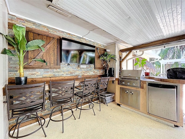 4966 Foxrun Ln, Lakeland, FL 33813 - view of patio with exterior kitchen and a bar