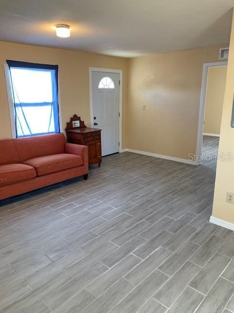 402 S Franklin St, Sebring, FL 33870 - entrance foyer featuring baseboards and light wood finished floors