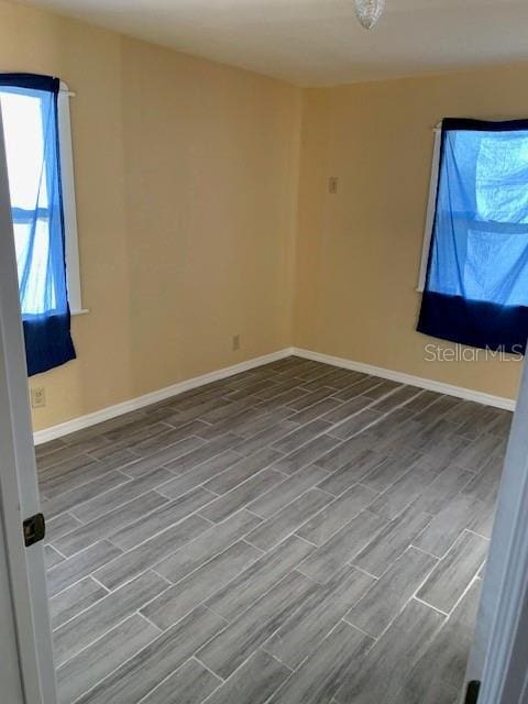 402 S Franklin St, Sebring, FL 33870 - unfurnished room featuring wood finished floors and baseboards