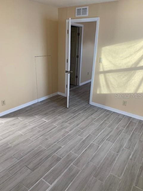 402 S Franklin St, Sebring, FL 33870 - unfurnished room with wood finished floors and baseboards