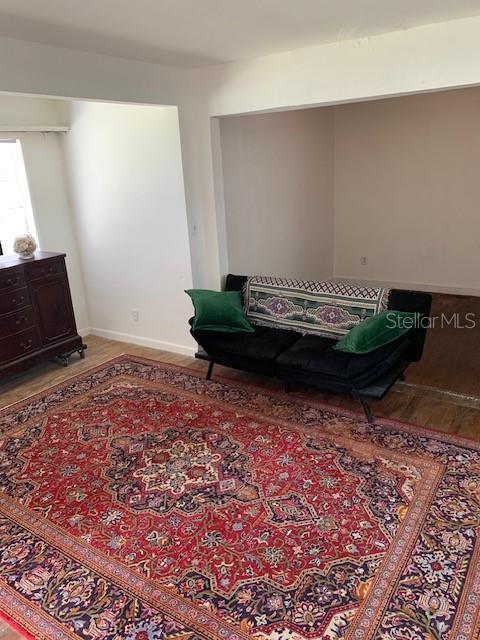 402 S Franklin St, Sebring, FL 33870 - living area featuring wood finished floors and baseboards