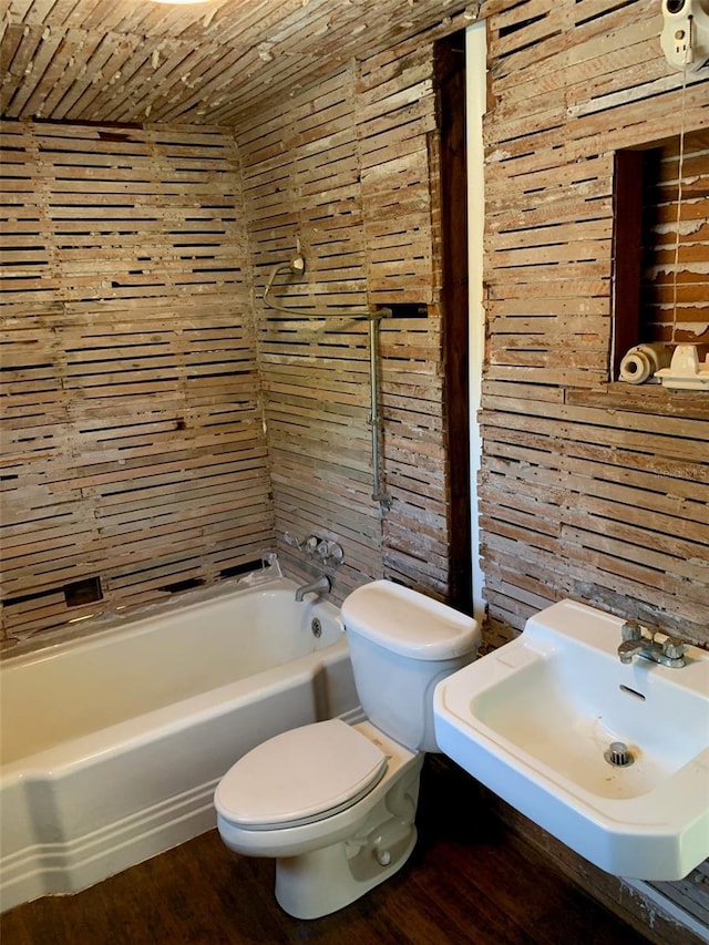 402 S Franklin St, Sebring, FL 33870 - bathroom with wood walls, shower / bath combination, wood finished floors, and wooden ceiling