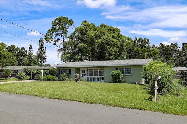 733 Oleander Dr SE, Winter Haven, FL 33880 - single story home featuring covered porch, a front lawn, and driveway
