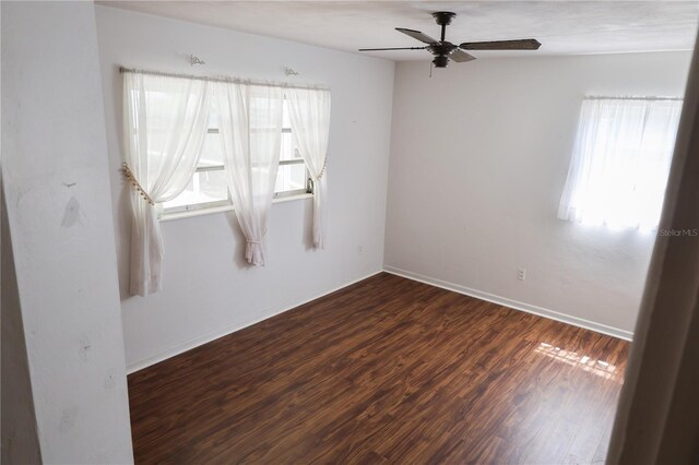 733 Oleander Dr SE, Winter Haven, FL 33880 - spare room with a ceiling fan and wood finished floors