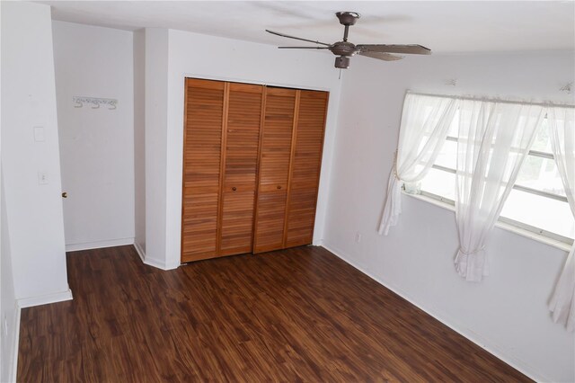 733 Oleander Dr SE, Winter Haven, FL 33880 - unfurnished bedroom featuring wood finished floors, a closet, and a ceiling fan