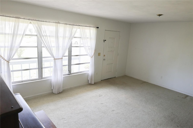 733 Oleander Dr SE, Winter Haven, FL 33880 - carpeted foyer entrance with baseboards