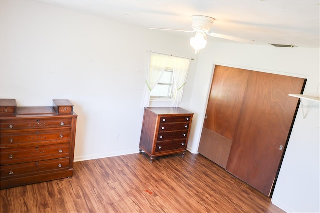 733 Oleander Dr SE, Winter Haven, FL 33880 - bedroom with wood finished floors, a closet, and ceiling fan