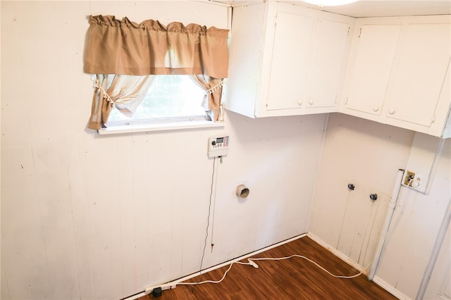 733 Oleander Dr SE, Winter Haven, FL 33880 - laundry room with cabinet space and dark wood-style floors