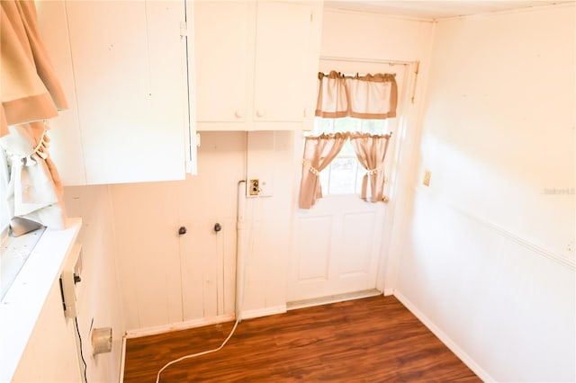 733 Oleander Dr SE, Winter Haven, FL 33880 - laundry room featuring dark wood-style flooring and baseboards