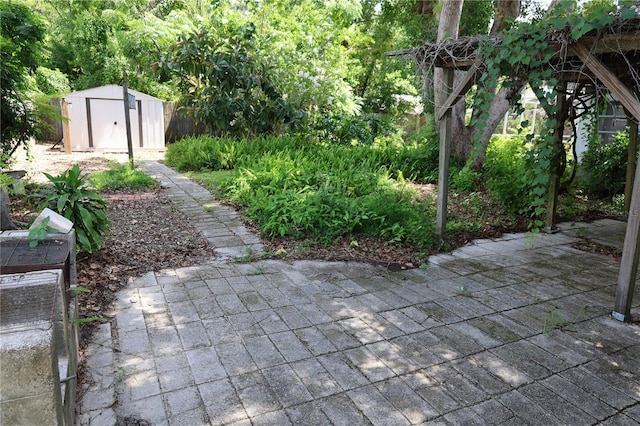 733 Oleander Dr SE, Winter Haven, FL 33880 - view of patio / terrace featuring a storage unit