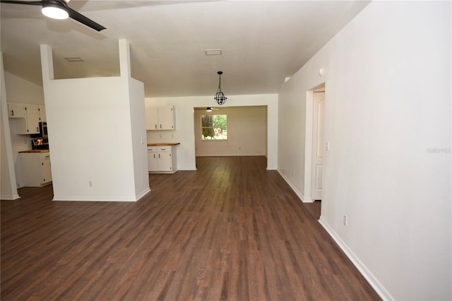 1922 N Torrington Rd N, Avon Park, FL 33825 - unfurnished living room with dark wood-style flooring and ceiling fan
