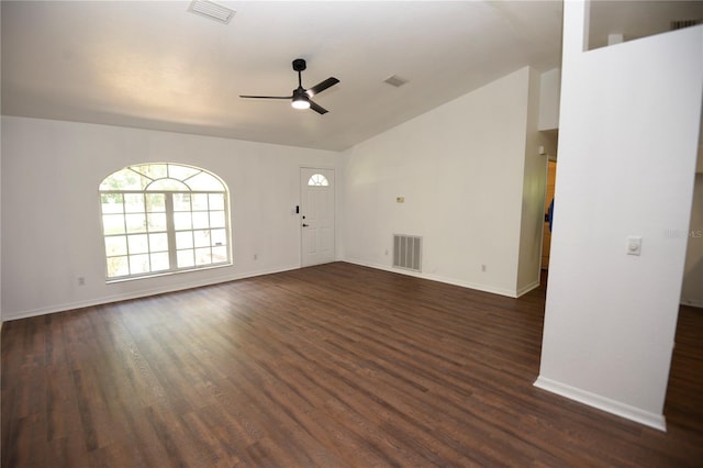 1922 N Torrington Rd N, Avon Park, FL 33825 - unfurnished living room with a ceiling fan, vaulted ceiling, and dark wood-style flooring